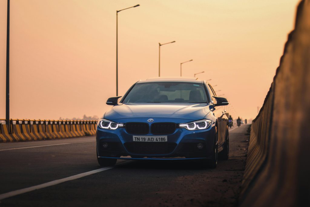 A Blue BMW F30 on a Street at Sunset · Free Stock Photo